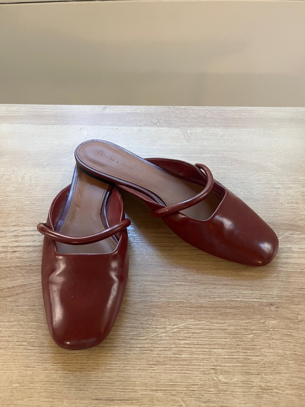 Leather burgundy flats with gold detail strap